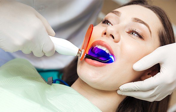 Woman receiving dental bonding treatment