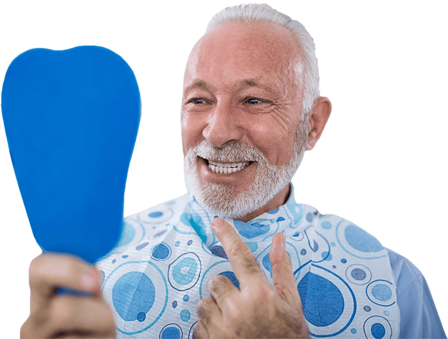 An older man looking at his smile in the mirror