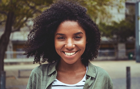 person smiling in a park