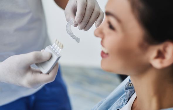 Dentist and patient with Invisalign