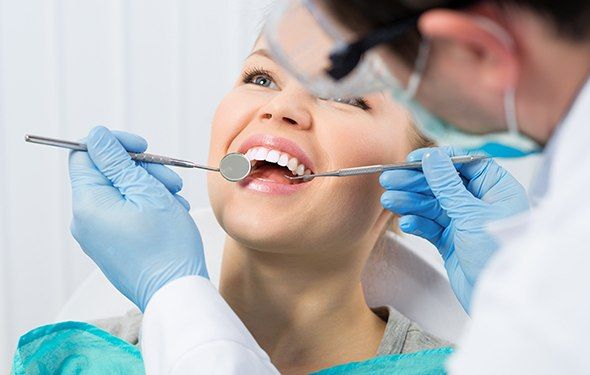 Woman receiving dental checkup