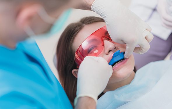 Woman recieving fluoride treatment