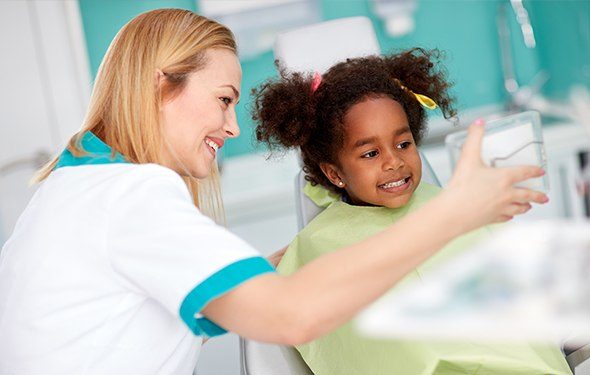 Smiling child in dental chair