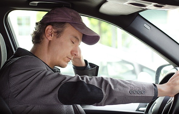 Man falling asleep while driving